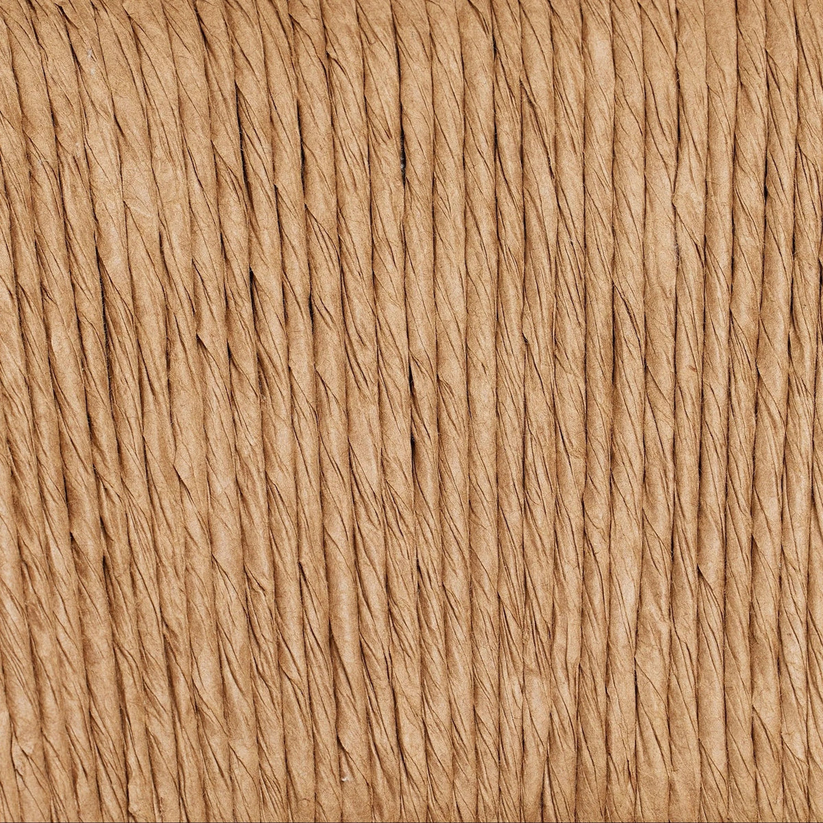 Close-up of natural tan rope weave showing tightly twisted vertical fibers and textured woven pattern used on the stool's C-back.