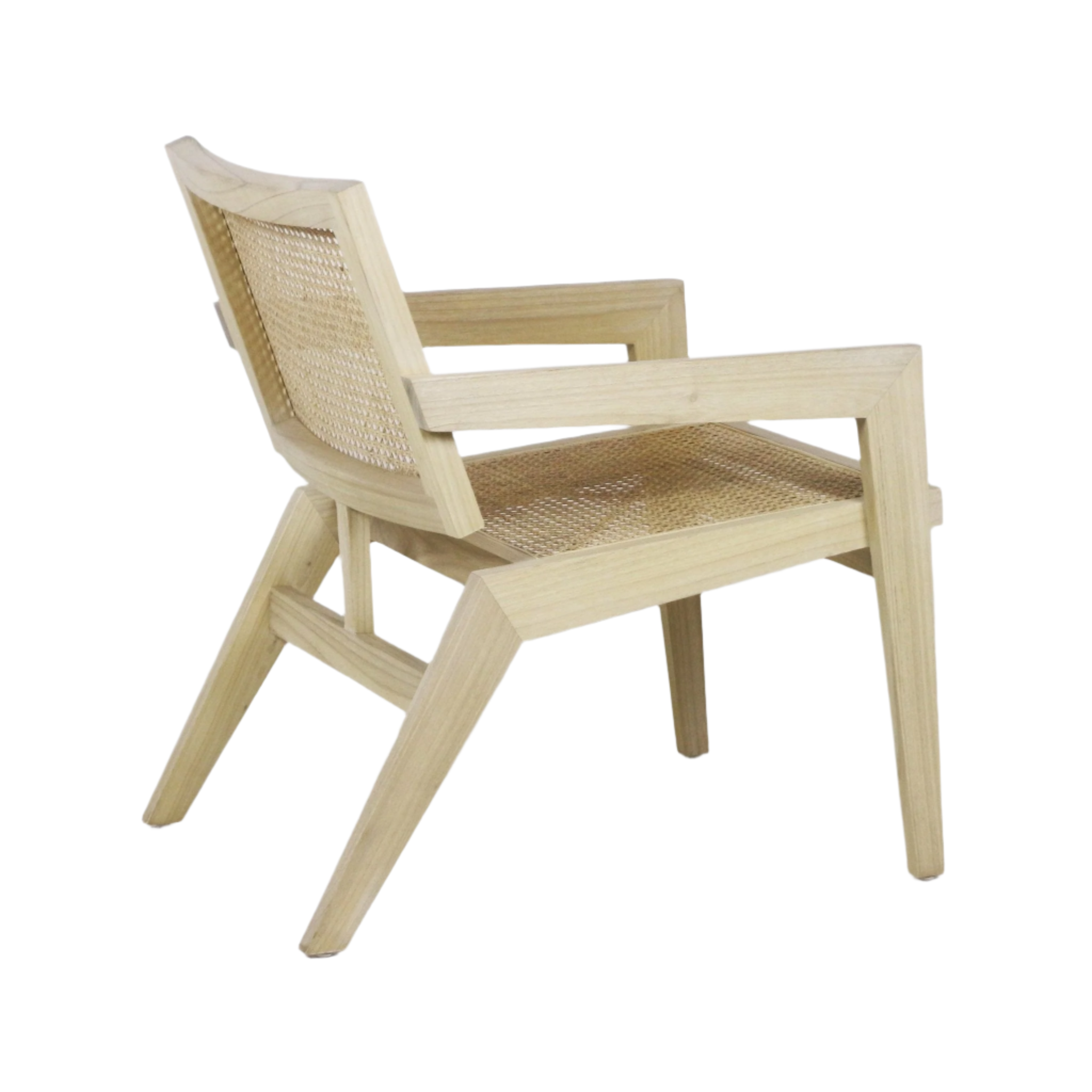 Angled rear-side view of a natural blonde solid wood lounge chair with woven cane seat and back, sculpted wooden armrests and angled mid-century modern legs.