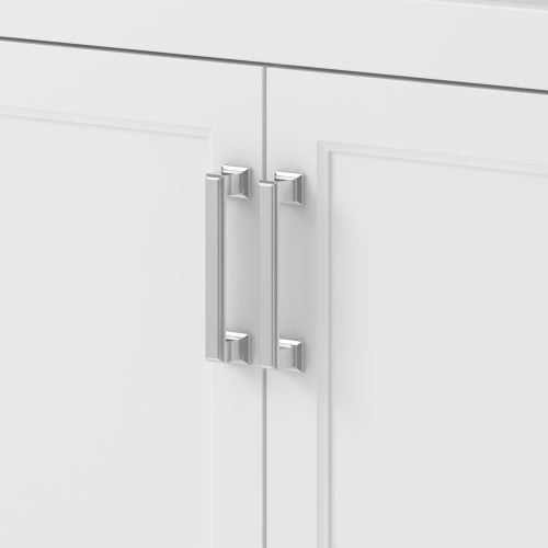 Close-up of chrome rectangular bar handles mounted on two shaker-style cabinet doors of a stone-colored solid wood bathroom vanity, showing vertical pulls with square mounting posts.