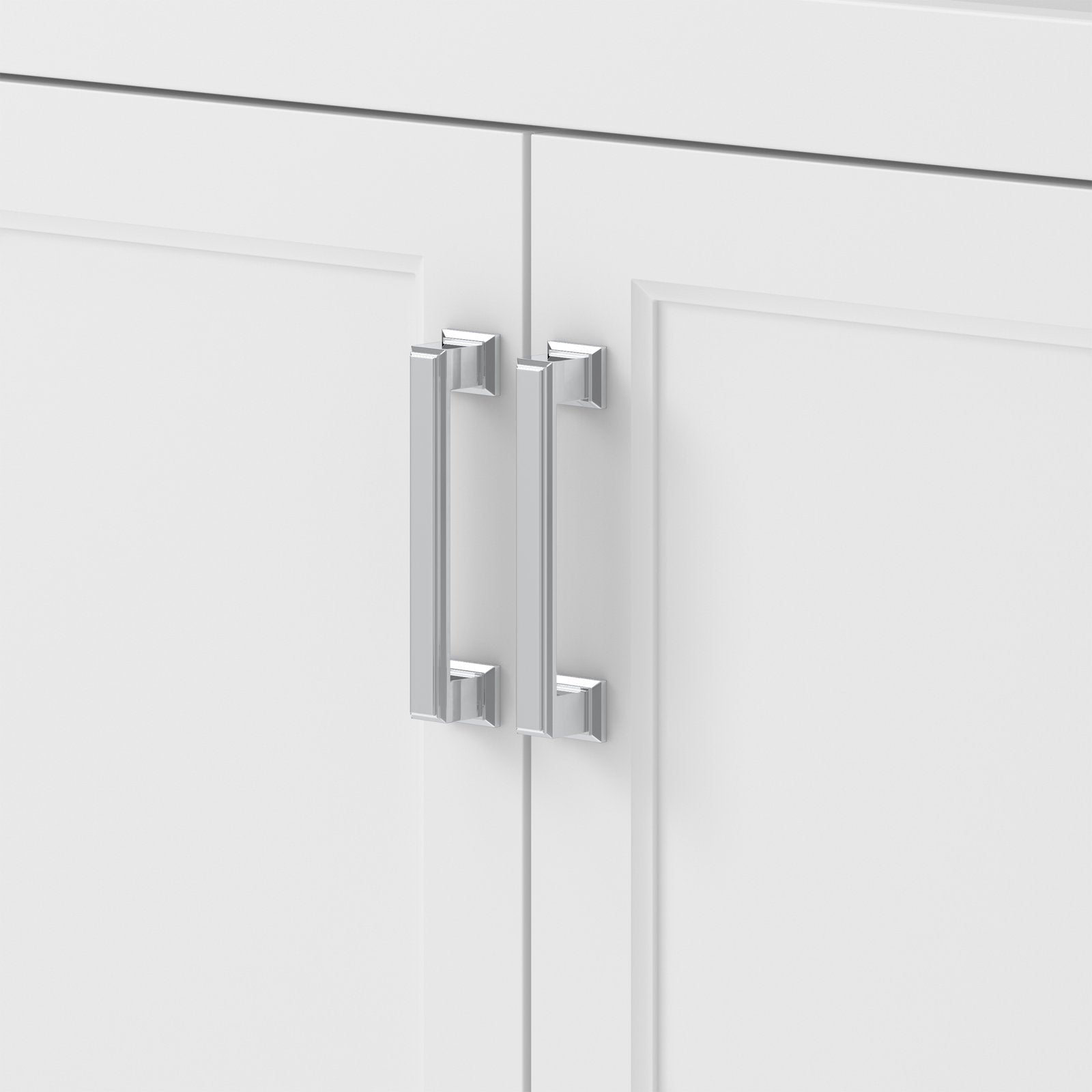 Close-up of two polished chrome bar handles mounted on adjacent white shaker-style cabinet doors of a modern solid wood bathroom vanity.