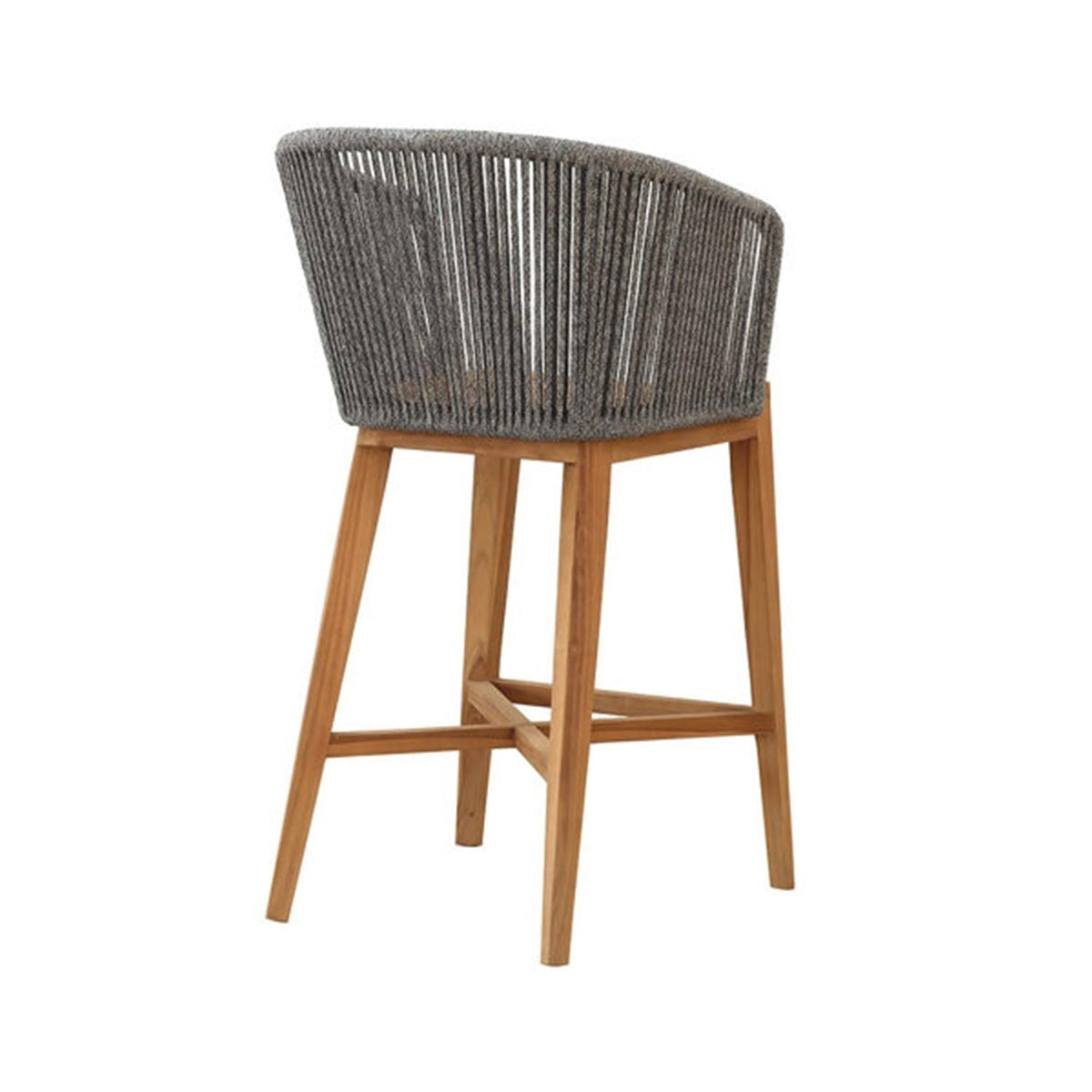 Rear three-quarter view of a teak outdoor bar stool with natural teak legs, cross-stretcher footrest and a curved grey rope-wrapped back with a cushioned seat in a coastal contemporary style.