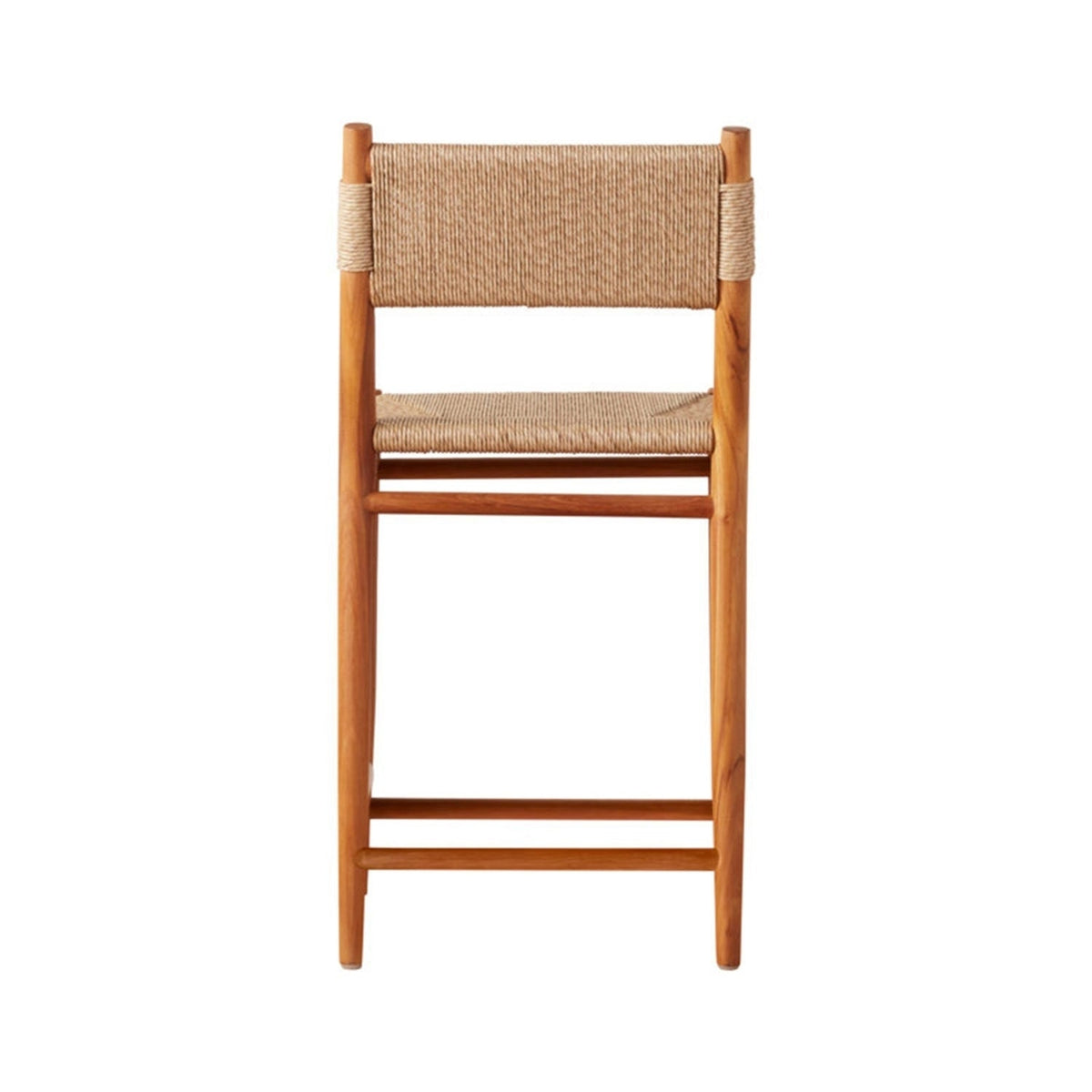 Front view of a natural teak armless bar stool with woven fiber seat and back, slim teak frame and horizontal footrest, coastal-modern farmhouse silhouette for indoor or outdoor counters.