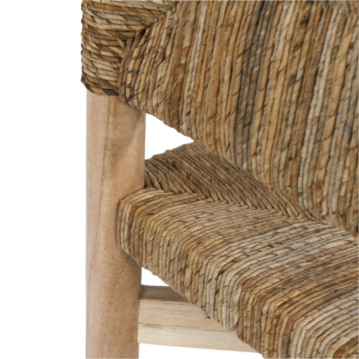 Close-up of a counter stool showing natural seagrass rope weaving on the seat and back paired with a light oak wood leg and stretcher.