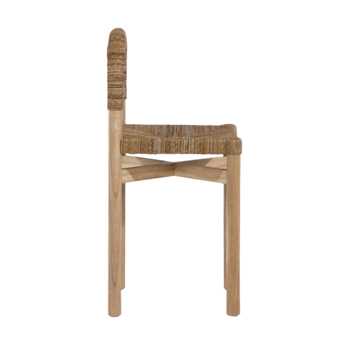 Side profile of a coastal counter-height stool with a natural oak frame, woven seagrass seat and rope-wrapped back, showing crossed stretcher support and tapered wooden legs.