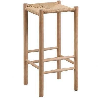 Backless natural wood bar stool with round legs and a woven beige rope seat, minimalist modern silhouette with horizontal crossbar footrests on all sides.