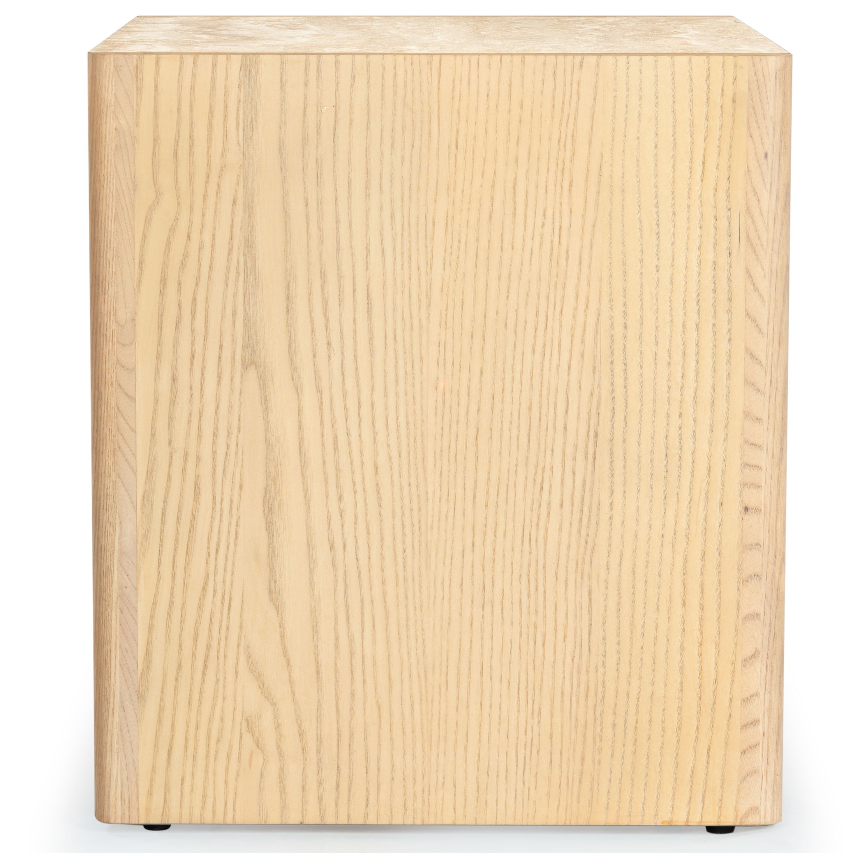 Side view of a natural ash wood nightstand showing vertical wood grain on the cabinet side, a thin light marble top edge and small black feet against a white background.