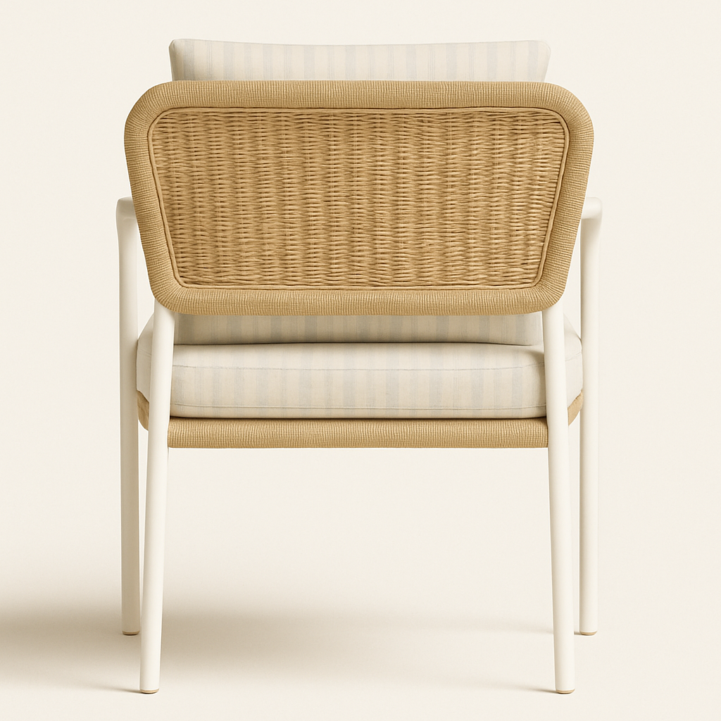 Rear view of a modern patio dining chair with a woven natural wicker back, beige striped cushioned seat and back, and a slim white aluminum frame with arm supports.
