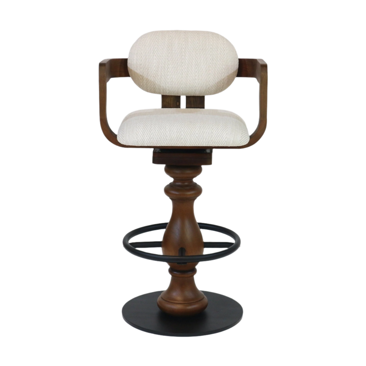 Beige upholstered bar stool with a rounded back and curved wooden armrests, turned natural wood pedestal, and black metal foot ring with a round base; counter-height swivel seat in a modern style.