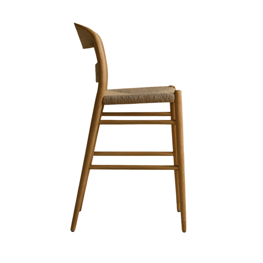 Side view of a mid-century modern natural solid wood bar stool with a curved wooden back, tapered legs and a woven papercord seat in a neutral natural finish.