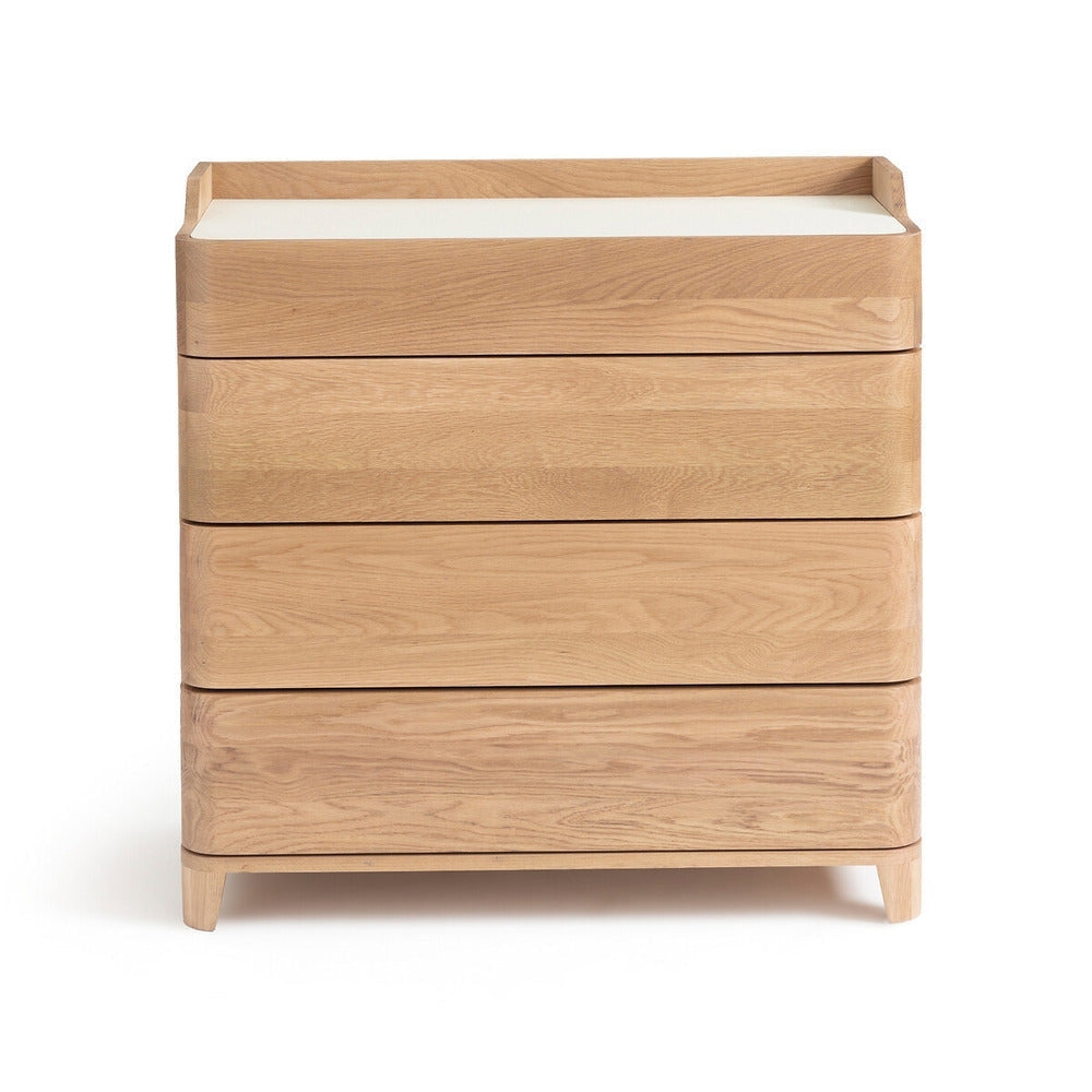 Blonde solid wood four-drawer dresser with a white linoleum top, rounded edges and tapered legs, shown against a white background in a modern contemporary style.