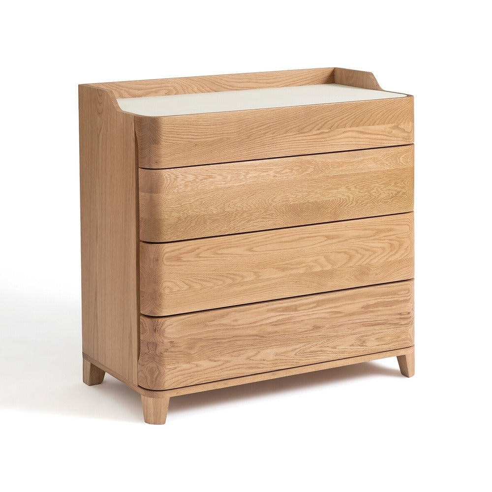 Modern blonde solid wood dresser with a white linoleum top, three rounded-front drawers showcasing natural wood grain, and short tapered legs, photographed on a white studio background.