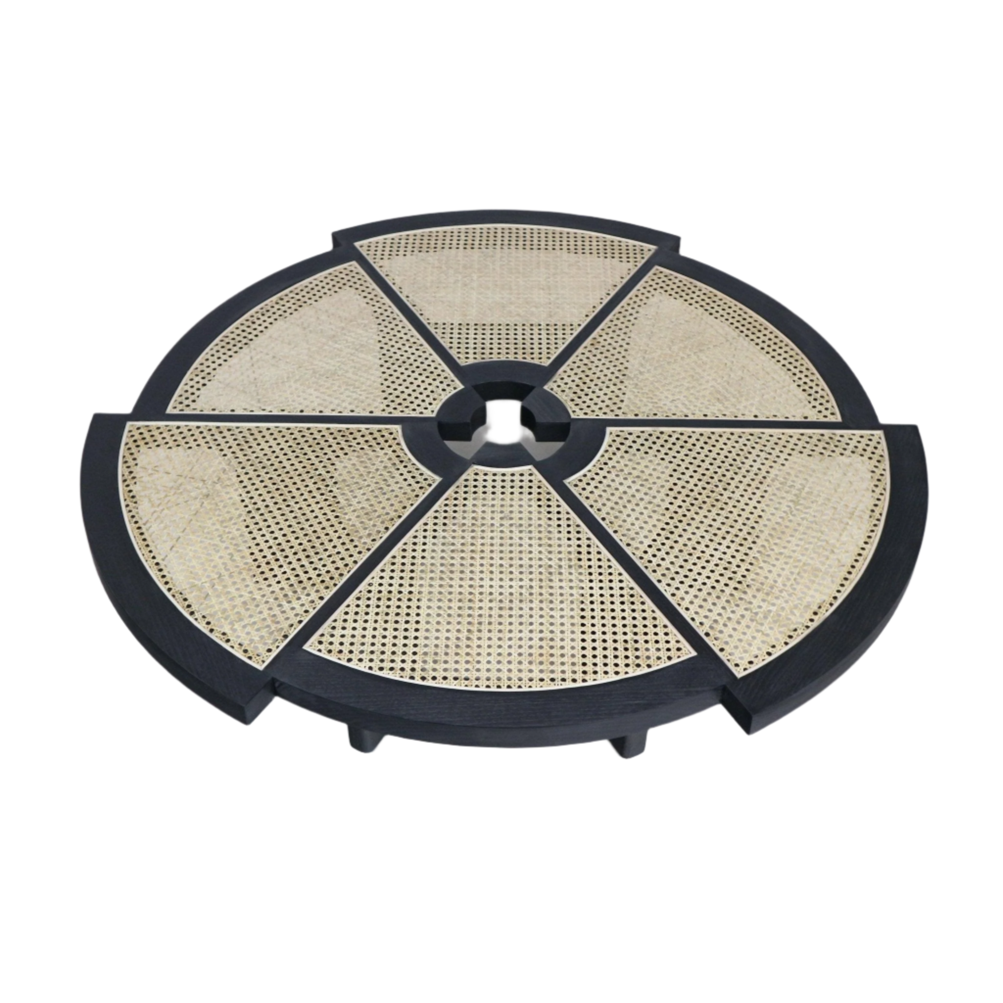 Round modern coffee table with a black wood frame and six natural cane-woven wedge panels radiating from a central circular opening, shown from above.