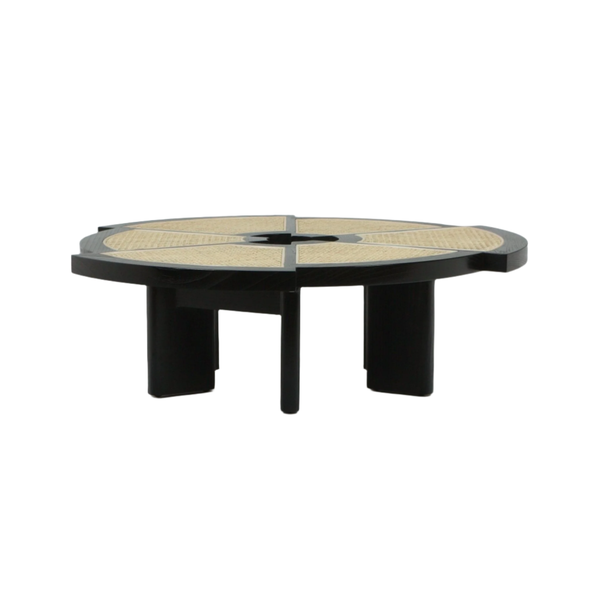 Low round coffee table with a black wooden frame and segmented natural cane inlay top divided into wedge panels, supported by thick black legs on a white background.