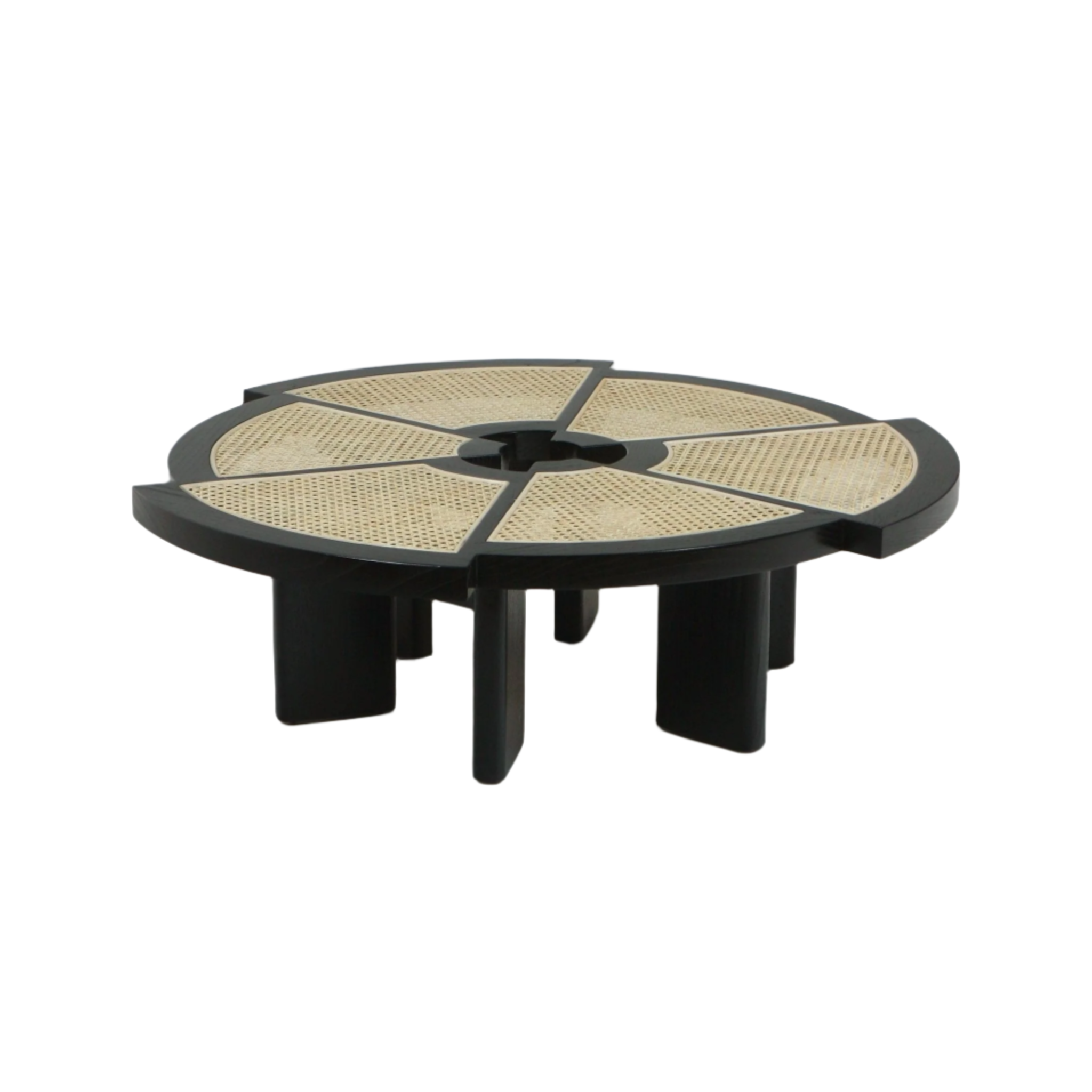 Low round coffee table featuring a black wooden frame with six wedge-shaped natural cane panels, a central circular cutout and chunky sculptural legs for a modern midcentury look.